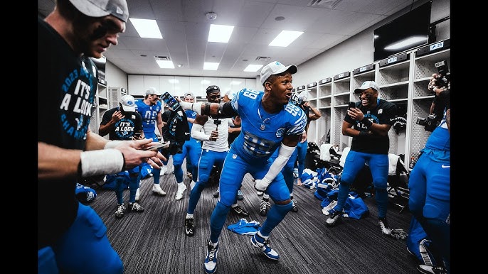 Detroit Lions players celebrating in the locker room